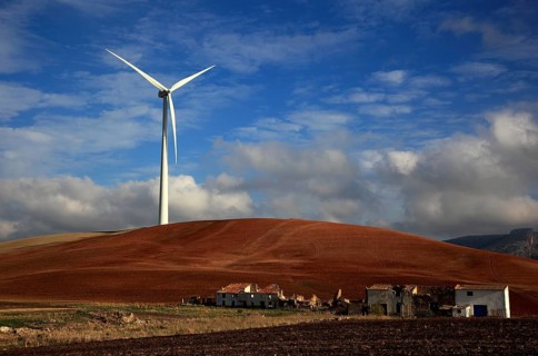 Windmill and dilapidated houses in front of it