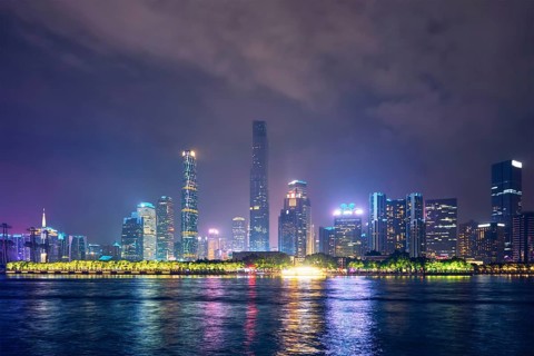 Guangzhou cityscape skyline over the Pearl River illuminated in the evening. Guangzhou