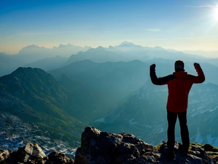 Climbers in victory pose at the summit of Krn 2. 244m