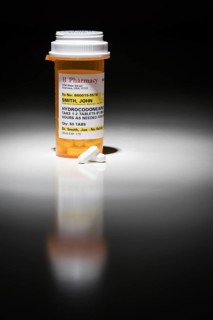 Hydrocodone pills and prescription bottle with non proprietary label. no model release required