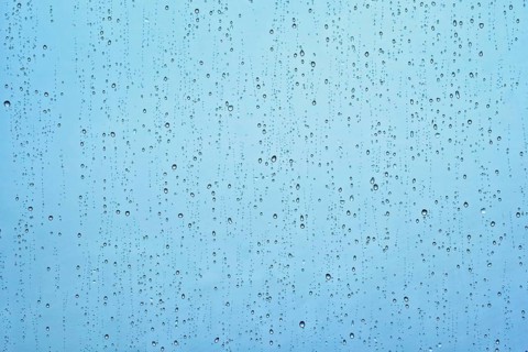 Rain water drops droplets on window glass texture background