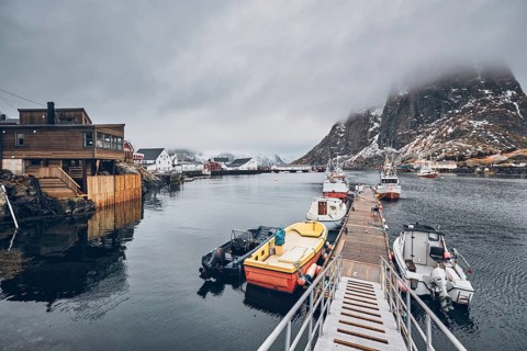 Pier with ships in Hamnoy fishing village on Lofoten Islands
