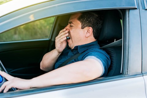 Tired driver yawning