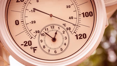Round thermometer showing over 110 degrees
