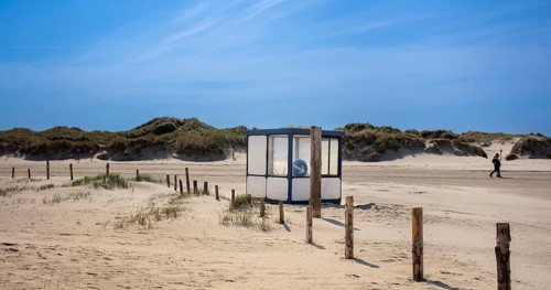 Beach with wooden planks and guard house