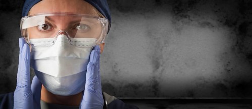 Female doctor or nurse wearing goggles