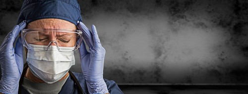 Female doctor or nurse wearing goggles