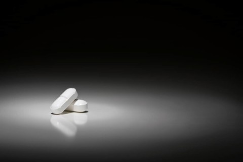 Hydrocodone prescription pills under spot light