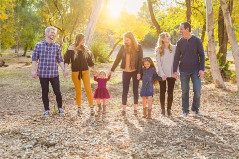 Multigenerational mixed-race family portrait outdoors