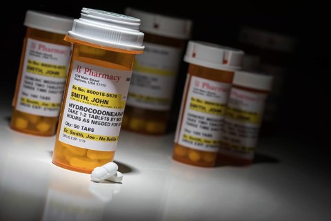 Hydrocodone pills and prescription bottles with non proprietary label. no model release required