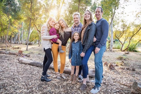 Multigenerational mixed-race family portrait outdoors