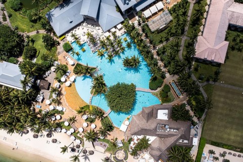 Aerial view The beach of Flic en Flac with luxury hotel Sugar Beach Resort & Spa and palm trees
