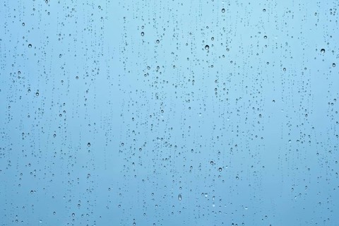 Rain water drops droplets on window glass texture background