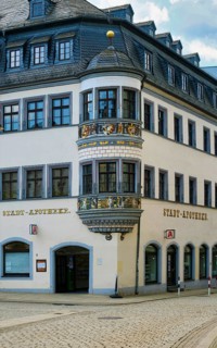 City pharmacy with richly decorated oriel