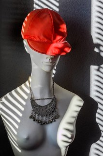 White fashion doll with red baseball cap and oriental silver jewellery