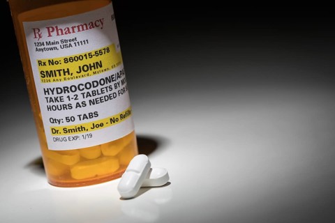 Hydrocodone pills and prescription bottle with non proprietary label. no model release required