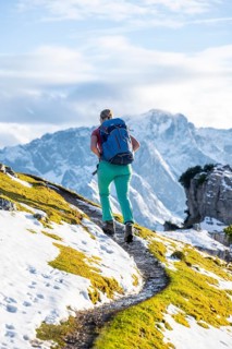 Young female hiker on hiking trail to Kramerspitz