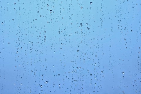 Rain water drops droplets on window glass texture background