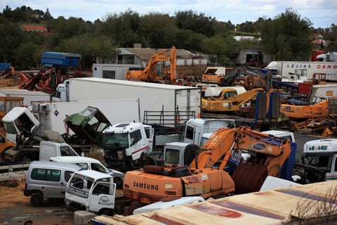 Car cemetery with truck