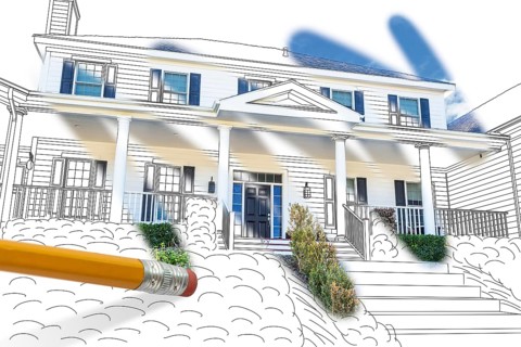 Pencil erasing drawing to reveal finished custom house design photograph