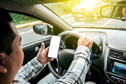 Distracted driver using the cell phone while driving
