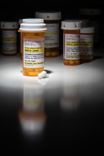 Hydrocodone pills and prescription bottles with non proprietary label. no model release required