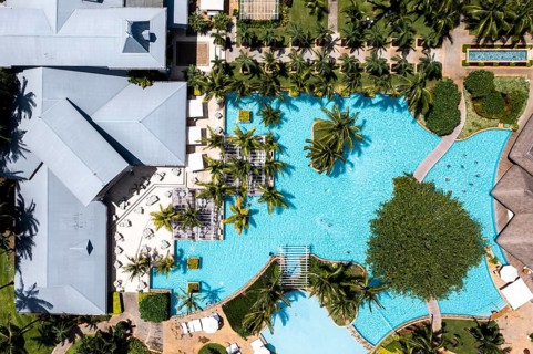 Aerial view The beach of Flic en Flac with luxury hotel Sugar Beach Resort & Spa and palm trees