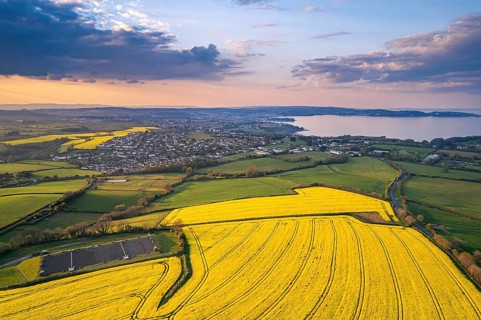 Sunset over Devon Fields and Farmlands from a drone