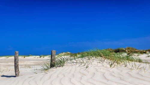 Beach with wooden planks and guard house