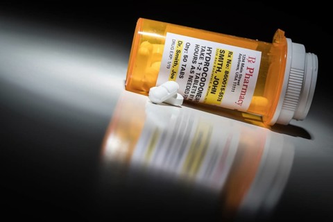 Hydrocodone pills and prescription bottle with non proprietary label. no model release required