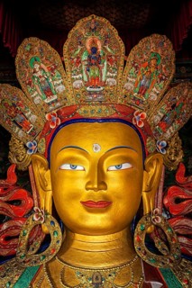 Maitreya Buddha statue face close up in Thiksey Gompa. Ladakh