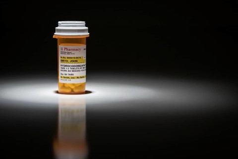 Hydrocodone pills and prescription bottle with non proprietary label. no model release required
