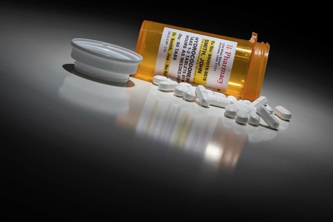 Hydrocodone pills and prescription bottle with non proprietary label. no model release required