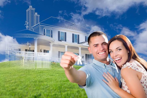Happy military couple holding house keys with ghosted house drawing