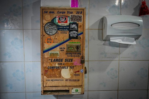 Condom vending machine in toilet in Beer Garden