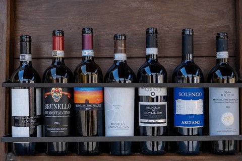 Wine bottles standing on shelf