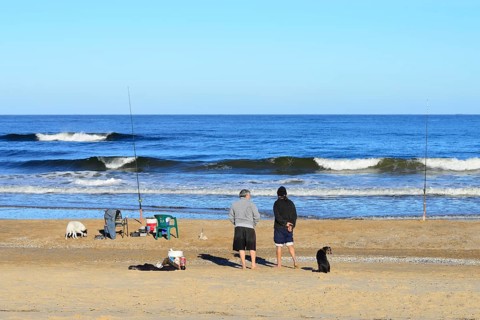 Two anglers on the beach Playa Brava