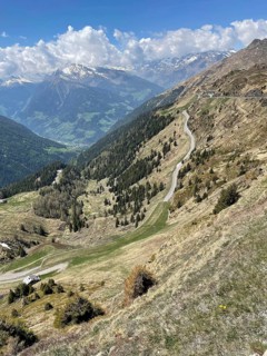 View from pass summit of mountain pass Jaufenpass to south ramp with southern ascent