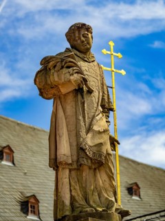 Sculpture of the patron saint Peter in front of the Einhard Basilica St. Marcellinus and Peter