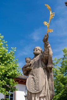 Sculpture of the patron saint Marcellinus in front of the Einhard Basilica of St. Marcellinus and Peter