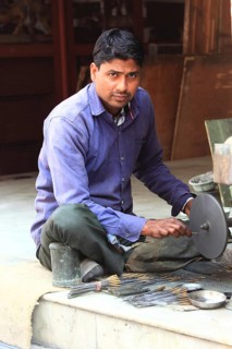 Man cutting gemstones