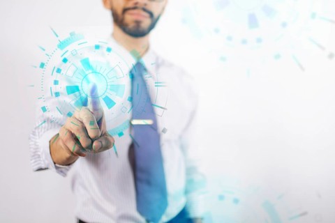 Businessman touching holographic icons