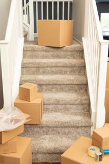 Abstract of stairs with new carpets and moving boxes