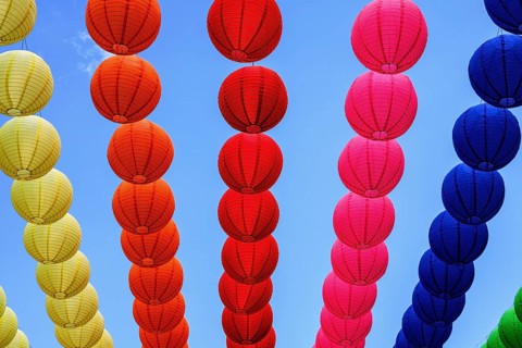 Colourful lanterns strung across the street