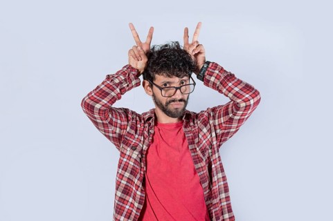 Man with fingers cuckolding