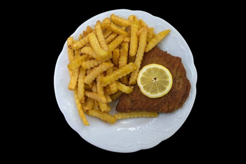 Cordon bleu with french fries on a black background