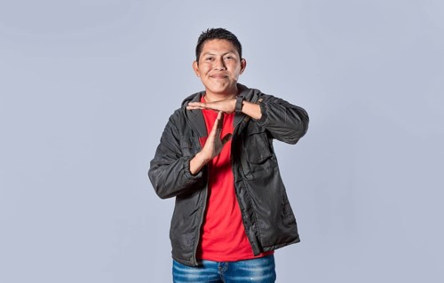Man making time out gesture