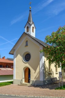 Lourdes Chapel from 1895 and red flowering horse-chestnut