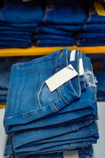Close up of blue jeans on others with copy space