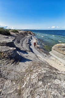 Hikers between limestone columns